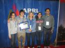 Padraig Lysandrou, KC9UUS, winner of the 2014 William R. Goldfarb Memorial Scholarship, with his family. From left to right, sister Helena, KC9VIM; Padraig, KC9UUS; mother Carolyn, KC9URR; sister Maria, and father Plato, KC9VIL. [Becky Schoenfeld, W1BXY, photo]